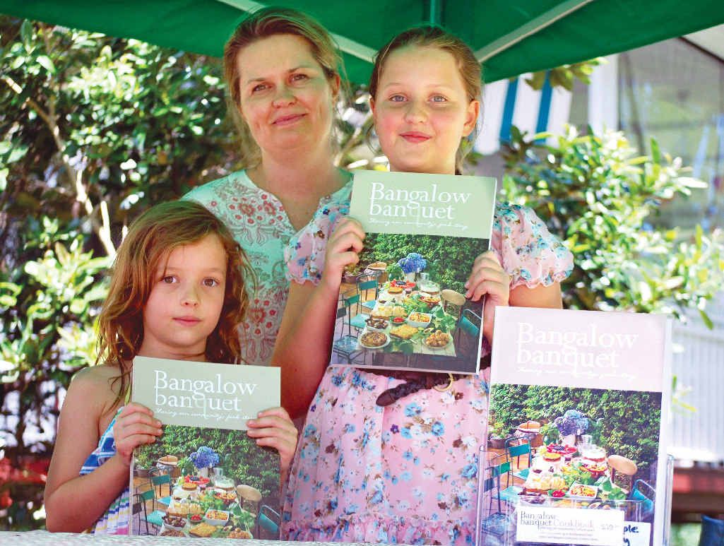 GOOD READ: Pleased with their copies of Bangalow Banquet are Kellie Doherty and daughters Bridget, 11, and Fianna, 7. GOOD READ: Pleased with their copies of Bangalow Banquet are Kellie Doherty and daughters Bridget, 11, and Fianna, 7.